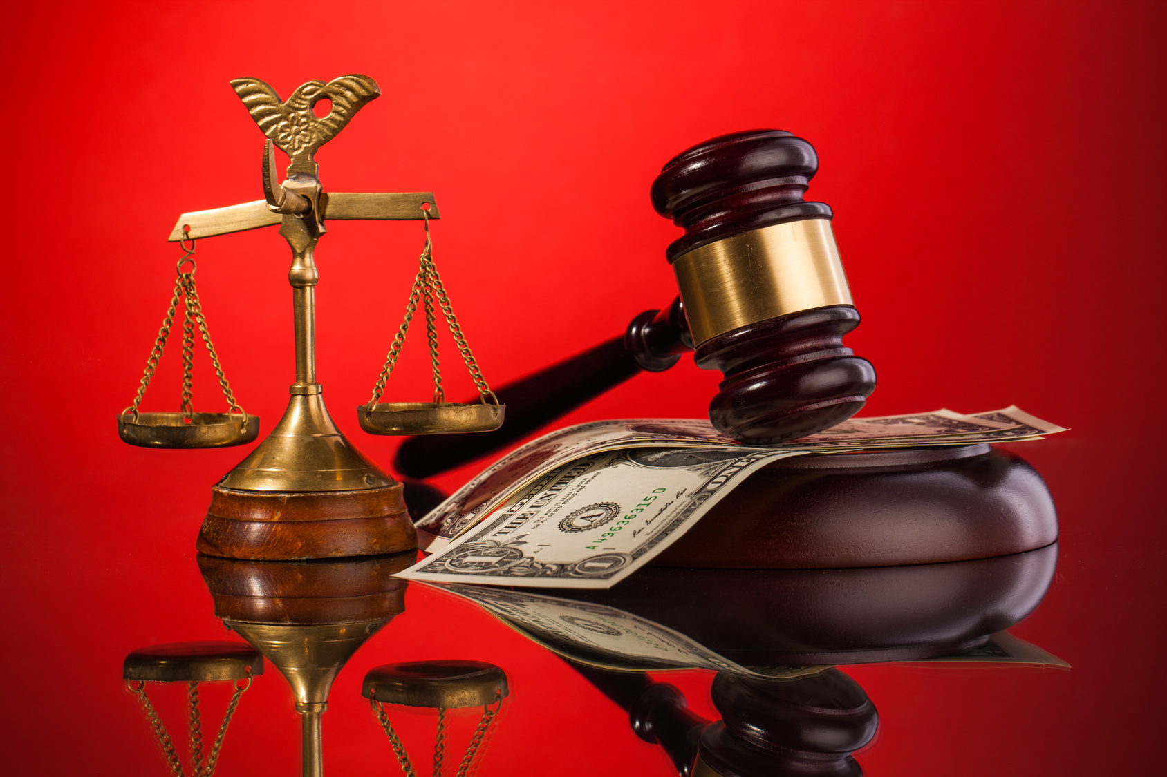 gavel, money , and scales of justice